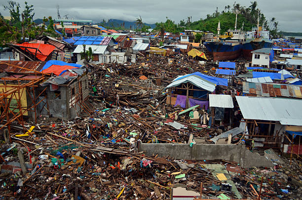 Typhoon Haiyan Damage, Tacloban A sweeping shot of Barangay Anibong, taken in the Philippine city of Tacloban after Typhoon Haiyan struck in November 2013. typhoon photos stock pictures, royalty-free photos & images