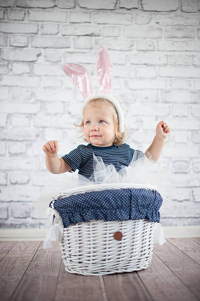 istock Cute baby bunny in the basket 505523103
