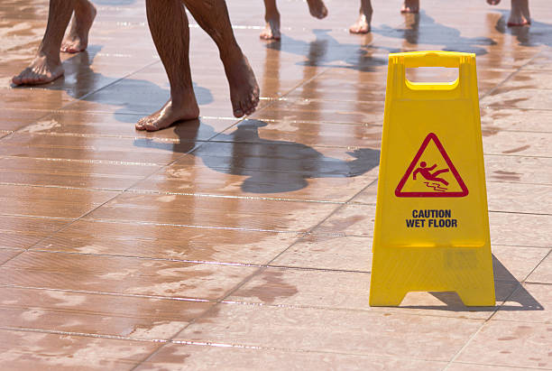 caution wet floor - smooth part of colors yellow imagens e fotografias de stock