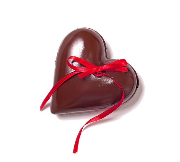 chocolate heart and red riibbon stock photo