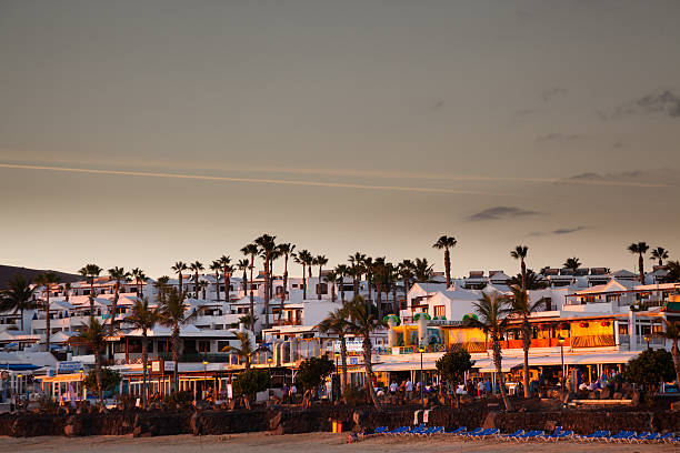 istock promenade and shops sunset beach resort Canary Islands 505523992