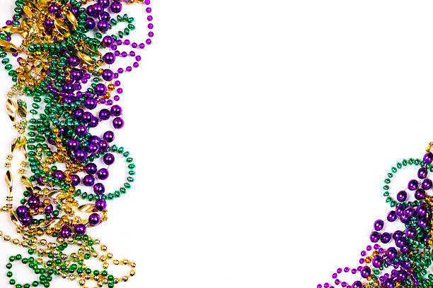 istock Mardi Gras background.  Purple, gold, green, beads. 505524082