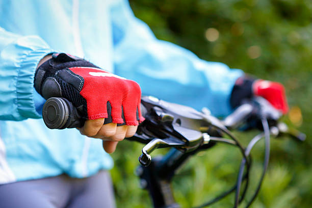 istock Closeup of hands in red protective gloves holding handlebar. 505525039