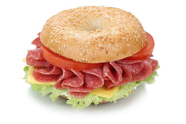 istock Bagel sandwich with salami ham isolated 505525890