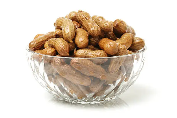 boiled peanuts in a bowl, isolated on white background