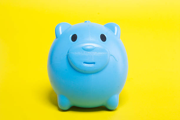istock Blue piggy bank on a yellow background. 505528602