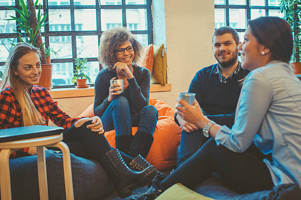 istock young people relaxing and chatting 505528812