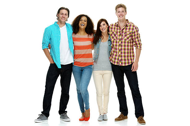 Four smiling people standing & looking at camera