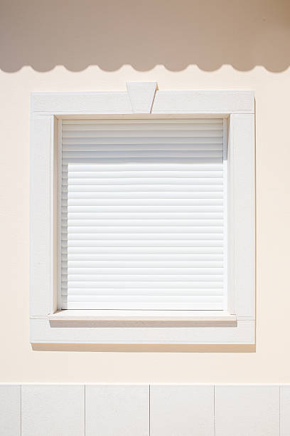 istock White shutter on a window in the sunshine 505532859