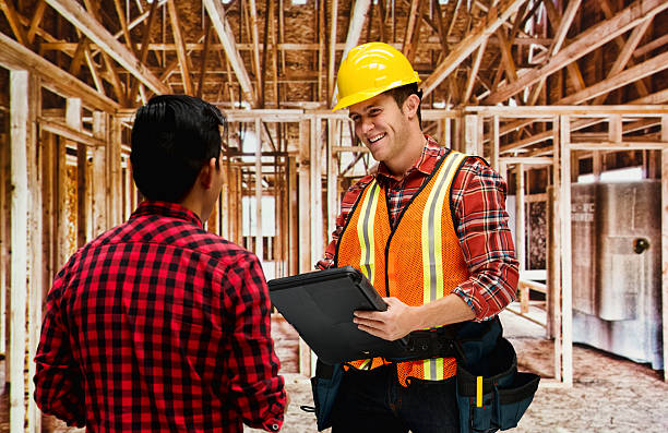 Building contractor discussion with customer Building contractor discussion with customerhttp://www.twodozendesign.info/i/1.png 24 x 24 frame stock pictures, royalty-free photos & images