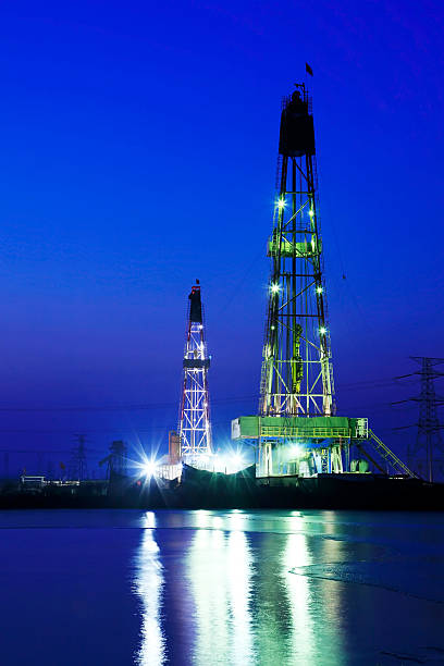 istock oilfield derrick at night 505533606