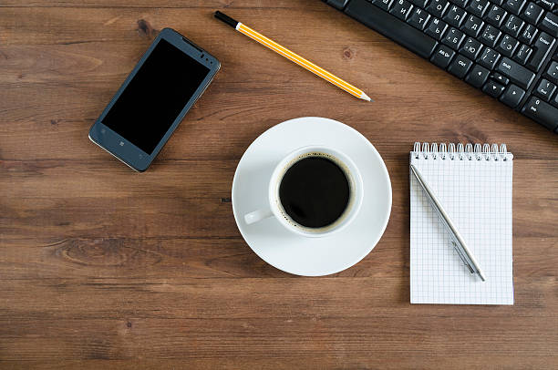 istock Black  keyboard, smart phone and office supplies 505533805