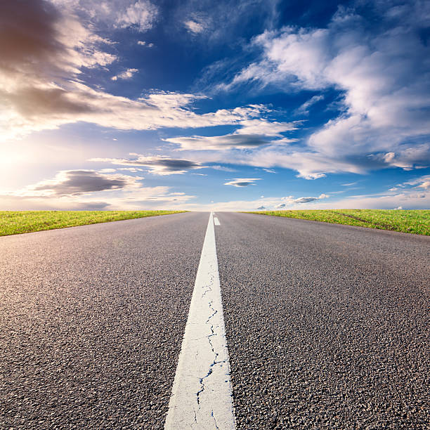 istock Driving on an empty asphalt road at sunny day 505533821