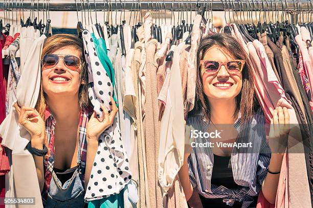Young Beautiful Women Shopping At The Weekly Cloth Market Stock Photo - Download Image Now