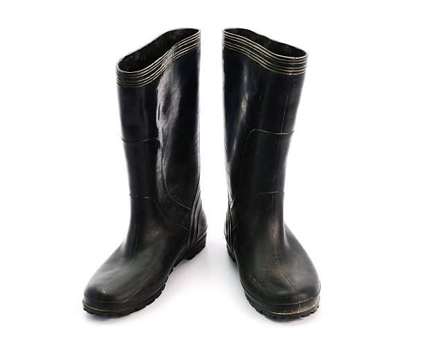 istock dirty black rubber boots isolated on white background 505535058