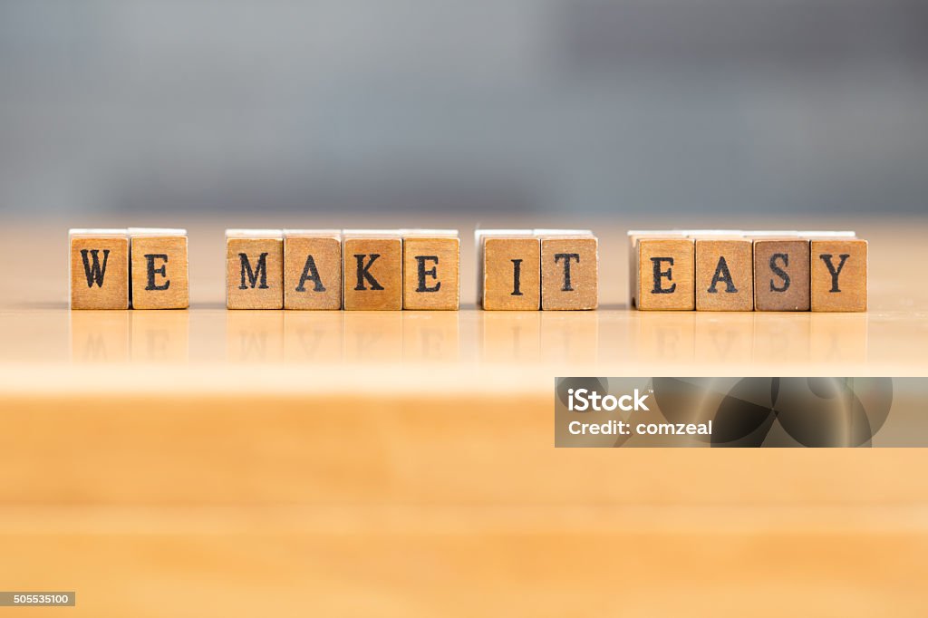 We make it easy. word written on wood block Effortless Stock Photo