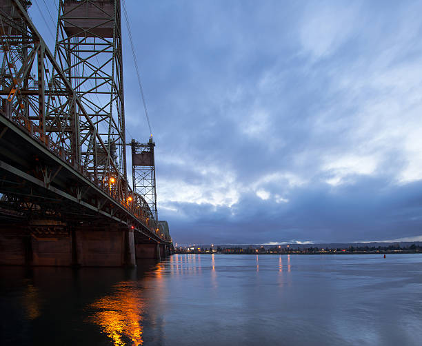 istock Long drawbridge over Columbia River with night lights reflection 505535520