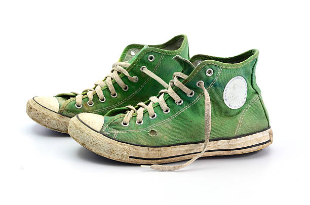 istock dirty sneakers isolated on a white background 505535854
