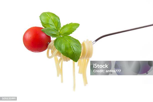 Spaghetti With Cherry Tomatoes And Basil On Fork Stock Photo - Download Image Now - Aromatherapy, Backgrounds, Basil