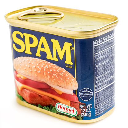 Miami, Florida, USA- May 27, 2015: A 12 ounces can of Clasic SPAM isolated on a white background. Spam stands for Spiced Pork and Ham, which is a canned precooked meat product. It is made by the Hormel Foods Corporation and was introduced in 1937.