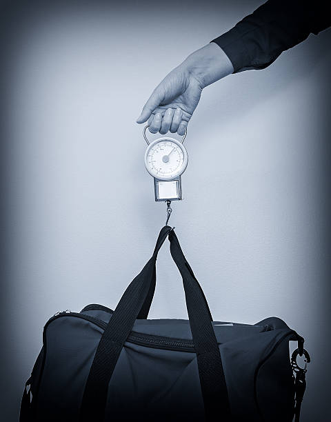 istock Hand luggage measurement using steelyard balance. 505536319