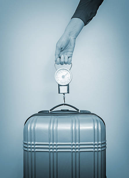 istock Hand luggage measurement using steelyard balance. 505536331