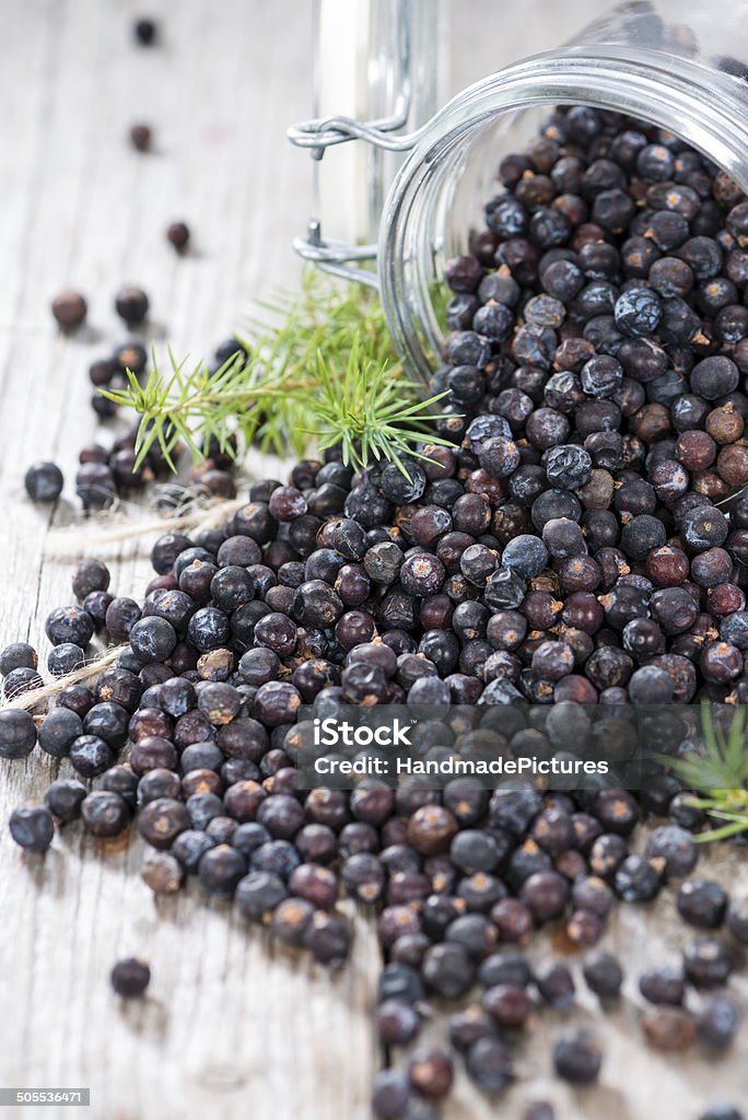 Portion of dried Juniper Berries Portion of dried Juniper Berries (close-up shot) Berry Stock Photo