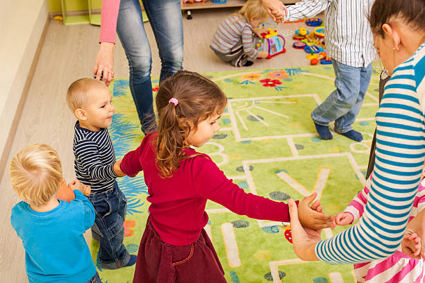 istock Group of little children dancing 505536748