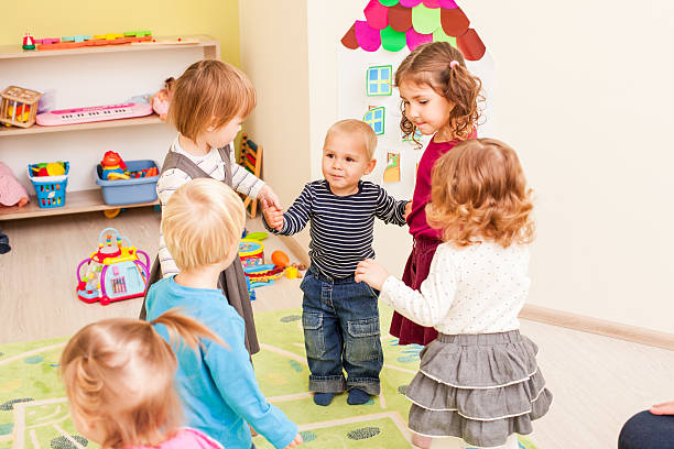 istock Group of little children dancing 505536884