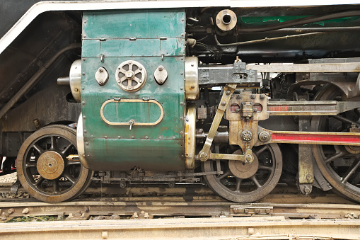 Closeup of train engine's wheel on the rail