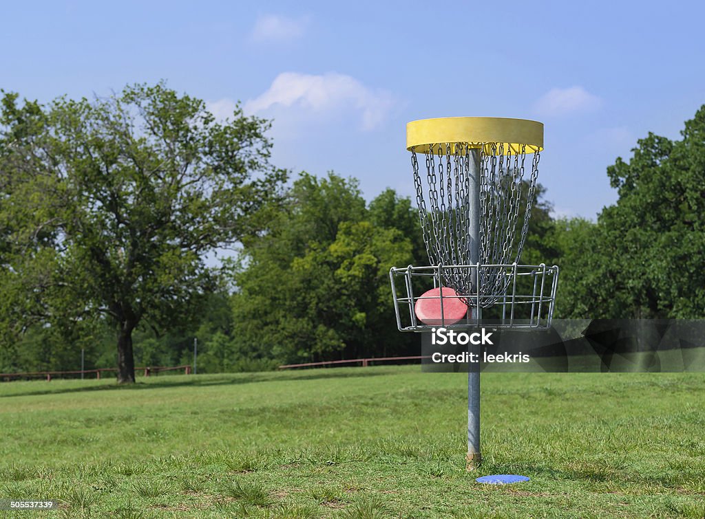 Disc golf basket Disc golf hole basket in a park Disc Golf Stock Photo