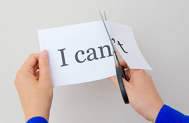 istock Female hand cutting paper with words. Concept. 505537993