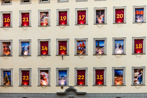 Bolzano, Italy - December 13, 2013: Advent calendar on the windows of a building in the old town of Bolzano.
