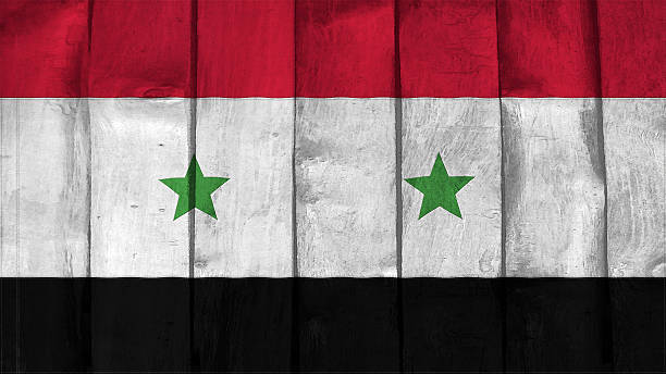 istock syria Flag on the wood texture 505538691