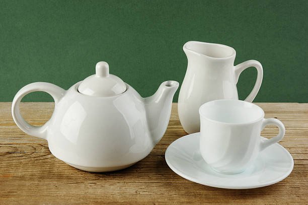 istock white ceramic coffee set on old wooden table 505546193