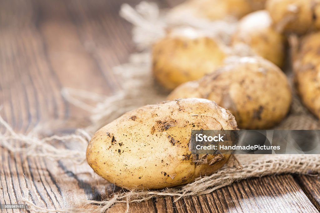 Potatoes Portion of fresh Potatoes on vintage background Agriculture Stock Photo