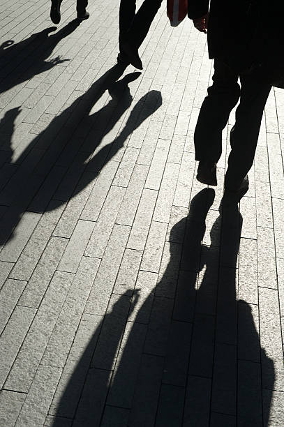 istock Abstract Shadows of Businessmen Walking 505553303