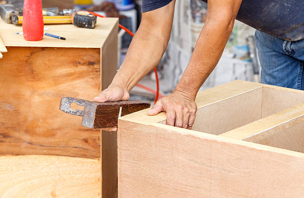 istock carpenter used planer for make new furniture 505561755