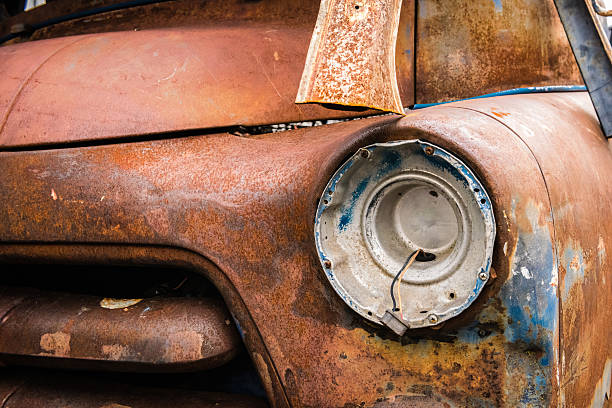 istock Front headlight of an rusty car in garage 505565688