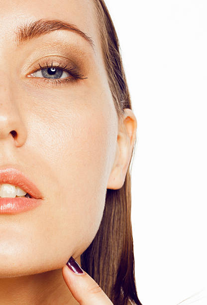 istock young attractive lady close up with hands on face isolated 505565904