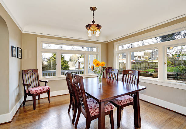 istock Bright dining room with wooden table set 505565959