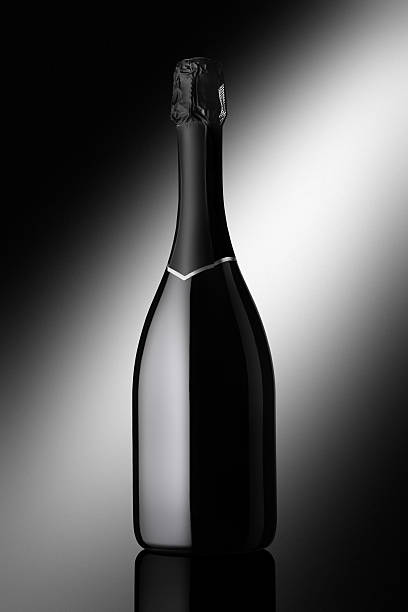 istock bottle of sparkling wine on a black background 505566951
