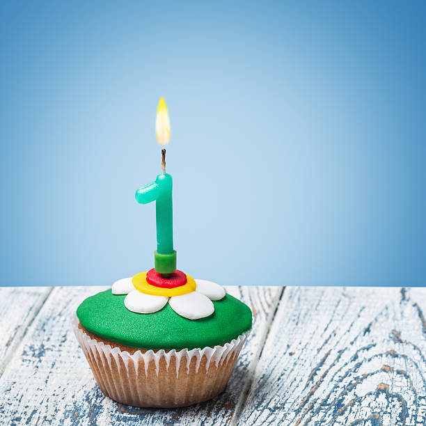 istock Cupcake with number one on a blue background 505567787