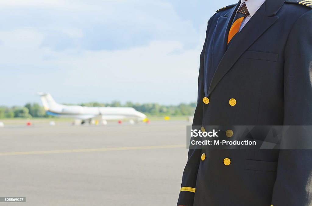 Pilot on the airfield. Place for your text. Adult Stock Photo