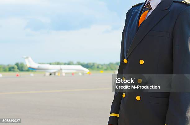 Pilot On The Airfield Place For Your Text Stock Photo - Download Image Now - Adult, Air Vehicle, Airplane