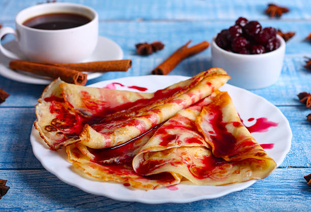 istock Breakfast pancakes with cherry jam on a blue background 505571878