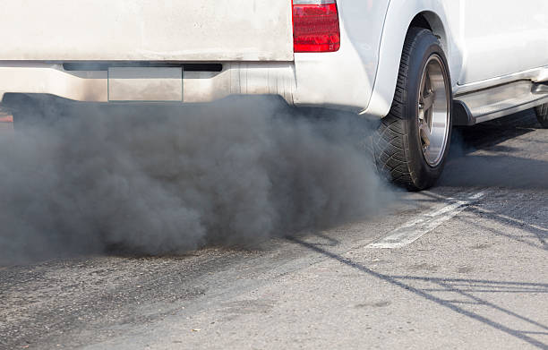 istock Air pollution from vehicle exhaust pipe on road 505573088