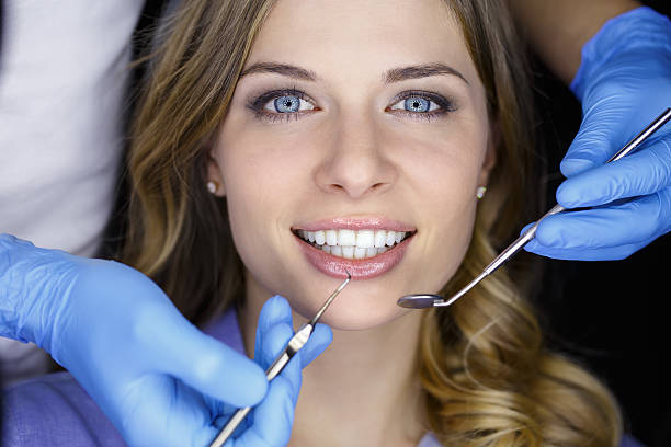 istock Dentist examining a patient's teeth in the dentist 505573106