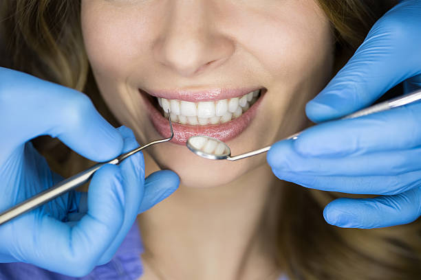istock Dentist examining a patient's teeth in the dentist 505573146