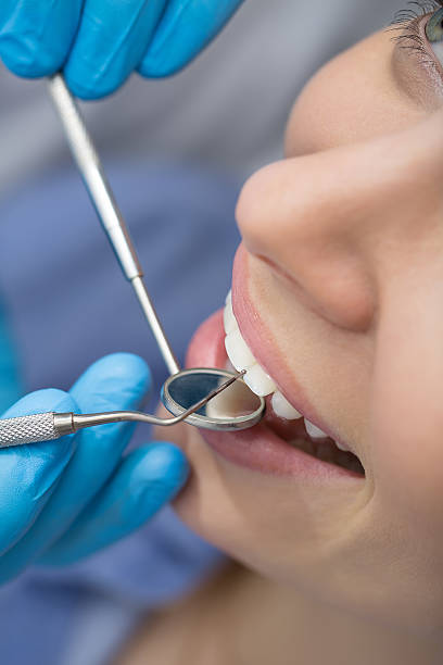 istock Dentist examining a patient's teeth in the dentist 505573170